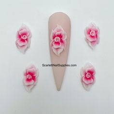 3D Nail Flowers - Pink Acrylic Flowers are Designed 100 % Handmade by Acrylic Powder. With the design underneath of the flowers, it helps to apply on the nail easily. How to apply 3D Acrylic Flowers on Nails: Flowers are handmade so it will sit nicely on your nail bed like it create it for you. Recommend using a bead of acrylic to adhere to your nails. Alternative is nail glue. Press and hold for a few seconds for it to stay in place. Top coat is necessary. To remove, use an cuticle nipper and c Pink Nails 3d Flowers, 3d Roses Acrylic Nails, 3d Rose Nail Art, How To Do 3d Acrylic Flowers On Nails, Acrylic Rose Nails 3d, 3d Acrylic Nails, 3d Nail Designs, Cuticle Nipper, Pink Acrylics