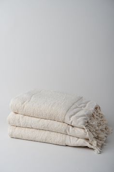 two white towels stacked on top of each other