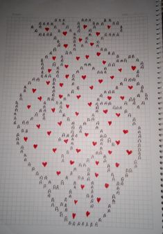 a spiral notebook with hearts drawn on it