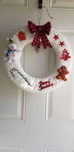 a christmas wreath hanging on the front door