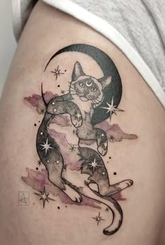 a woman's thigh with a cat on the moon and stars in the sky