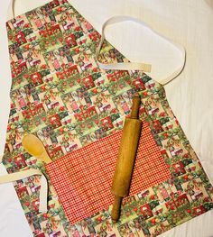 a wooden spoon sitting on top of an apron