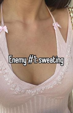 a woman wearing a pink shirt and necklace with the words enemy 1 sweating