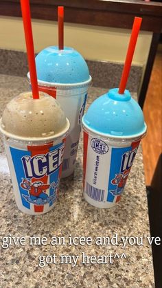 two ice creams sitting next to each other on a counter