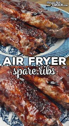 air fryer spare ribs on a blue and white plate with the title above it