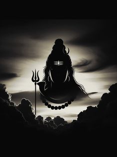 the silhouette of lord ganesha on a cloudy sky