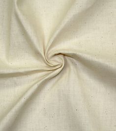 a close up view of a white fabric with small dots on it's surface