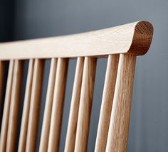 a close up view of a wooden bench with slats on the back and sides