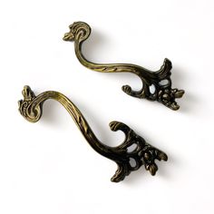 Two metal drawer pulls featuring subtle vines and leaves are against a white background. Dresser Hardware Ideas Drawer Pulls, Prima Redesign, Dresser Hardware, Modern Nautical, Redesign With Prima, Nautical Pattern, Room Upgrade, Prima Marketing, French Floral