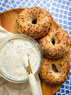 bagels and dip on a wooden platter