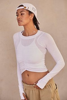 The perfect layer for every activity featured in a moves-with-you silhouette and long sleeve design with ruched bust detail for a forever flattering essential. * Crew neckline * Curved bottom hem * Soft, stretchy fit * Thumbholes in sleeves | Tempo Ruched Long Sleeve Top by FP Movement at Free People, White, XS Free People Activewear, Long Sleeve Design, Teal And Grey, New Today, Fp Movement, New Tops, Black Fits, Boho Clothing, Sleeve Designs