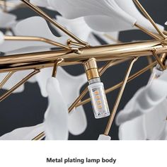 the metal plating lamp body is designed to look like leaves and has a light bulb on