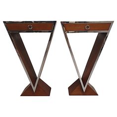 pair of art deco style side tables with mirrored top and metal base in walnut finish