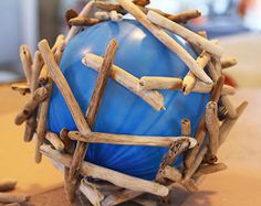 a blue ball with sticks sticking out of it