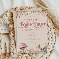 a birthday party is set up on a wicker basket with a stuffed animal next to it