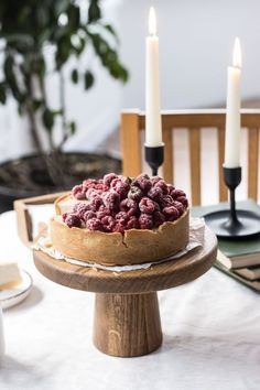 there is a cake on the table with two candles