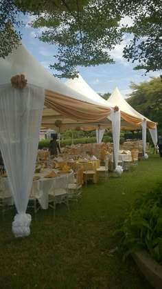 tables and chairs are set up under the canopy