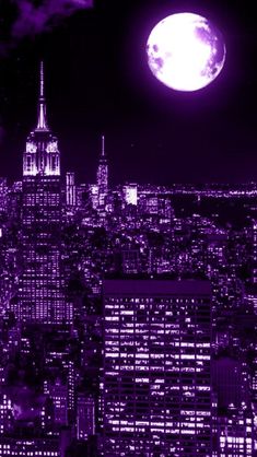 the city skyline is lit up in purple and white with a full moon behind it