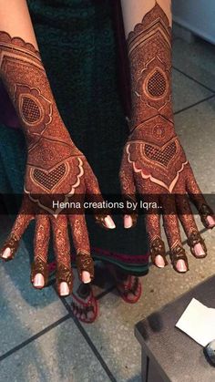 henna designs by igraa on her hands and feet with the words henna creations