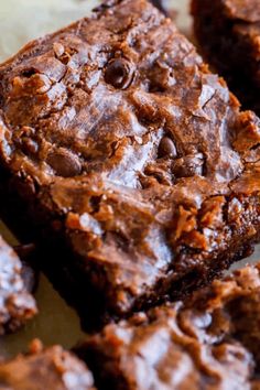 chocolate brownies are stacked on top of each other with one bite taken out of it