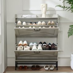 there are many pairs of shoes on the shelf