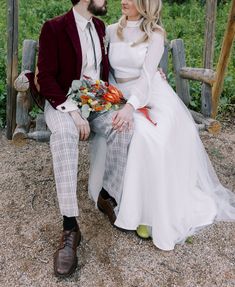 a man and woman are sitting on a bench