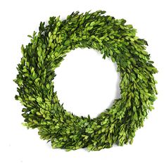 a wreath with green leaves is shown against a white background and looks like it could be used as an ornament