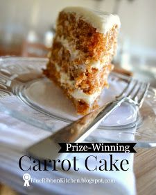 a piece of carrot cake sitting on top of a glass plate