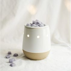 a white and brown container filled with marshmallows on top of a table