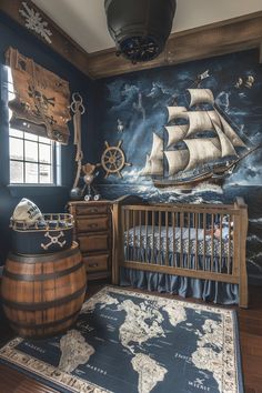 a baby's room with a ship painted on the wall