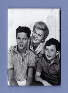 an old black and white photo of three people