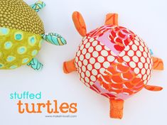 two stuffed turtle toys sitting next to each other on a white surface with the words stuffed turtles above them