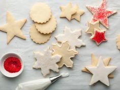 the cookies are decorated with icing and sprinkles, including one star