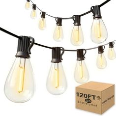 an assortment of light bulbs and string lights on a white background with a cardboard box