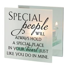 a candle is lit in front of a card that says, special people will always hold a special place in your heart just like you do in mine