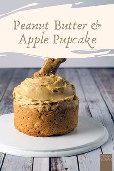 a cake on a plate with the words peanut butter and apple cupcake above it