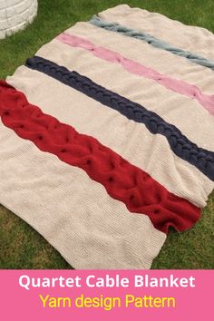 a blanket that is laying on the grass with text overlay saying, quart cable blanket yarn design pattern