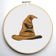 a cross stitch wizard hat on a white background