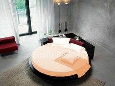 a round bed in the middle of a room