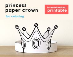 a paper crown sitting on top of a wooden table next to a white wall with the words princess paper crown for coloring