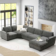 a living room with a sectional couch and coffee table