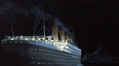 a large cruise ship in the water at night