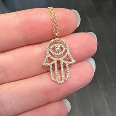 Large hamsa hand necklace with diamonds set in 14k yellow gold. There is an evil eye in the middle for protection. Adjustable chain from 16, 18, and 20 inches. Diamonds (0.23 ct) 14k yellow gold Dimensions: 19.5x13.8mm Please allow 6-8 weeks for production if the item is out-of-stock. Hamsa Hand Necklace, Necklace With Diamonds, How To Clean Silver, Hand Necklace, Artisan Gift, Professional Jewelry, Hamsa Hand, Mens Jewelry Bracelet, 8 Weeks