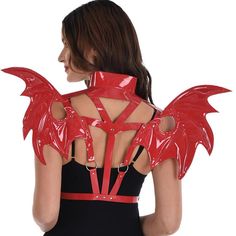 Complete your devilish club look or Halloween costume with these red wings for adults! The harness features shoulder straps with an attached collar that meet in the center and around the waist with adjustable buckles. The back has shiny vinyl wings joined in the middle by silver O-rings. pbRed Devil Club Wing Harness product details:-b-p ul liAdjustable front closure-li liVinyl plastic and metal-li liDoes not include dress pants or shoes-li liOne size fits most teens and adults-li -ul Red Devil Halloween Costume, Wing Harness, Demon Heart, Halloween Wings, Devil Wings, Club Look, Devil Halloween, Dressing Ideas, Devil Costume