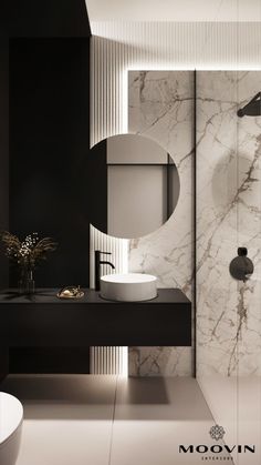 a modern bathroom with marble walls and flooring