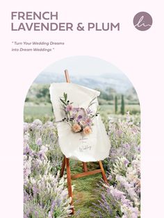 a white chair with flowers on it in the middle of lavenders and lavender bushes