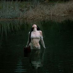 a woman floating on top of a body of water