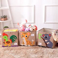 three cardboard boxes filled with stuffed animals on the floor in front of a white wall