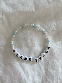 a beaded bracelet that says thank you all