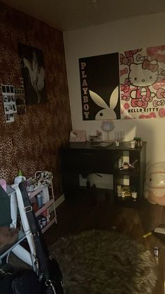 a living room filled with lots of furniture and wallpaper covered in hello kitty pictures